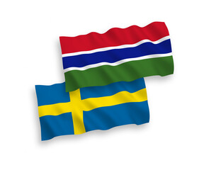 Fototapeta premium National vector fabric wave flags of Sweden and Republic of Gambia isolated on white background. 1 to 2 proportion.