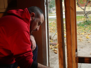 man carefully paints his furniture