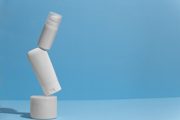 Set of blank white skincare cosmetic products on background with free space for advertising text.