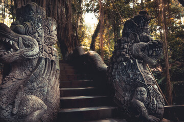 Bali Ubud monkey forest with dragons statue as travel tropical lifestyle background in vintage style