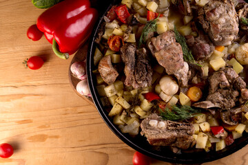 Grilled pork ribs on vegetables. Main course with a side dish.