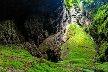 Macocha Abyss - large limestone gorge in Moravian Karst, Czech: Moravsky Kras, Czech Republic. View from bottom.