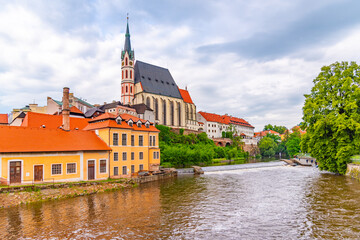 St Vitus church in the middle of historical city centre. View from Vltava River. Cesky Krumlov, Southern Bohemia, Czech Republic