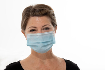Headshot of Caucasian female wearing  Covid 19 face mask isolated on white background