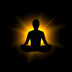 Black silhouette of a man sitting in a lotus position against a background of bright light