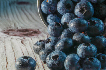 Fresh blueberries on a wooden board closeup