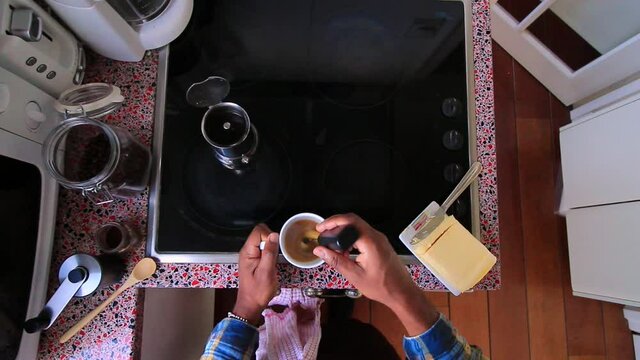Top view person preparing bulletproof coffee with nespresso machine