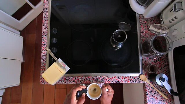 Top view person preparing bulletproof coffee with nespresso machine