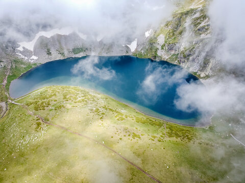 Aerial view of Babreka lake (The Kidney lake), one of the Seven Rila Lakes in Bulgaria during cloudy weather in July 2020