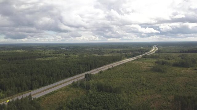 Amazing Overview of highway going Through Lush Forest and reaching to Horizon E4 in Sweden