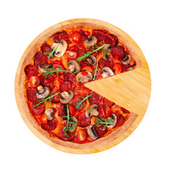 Tasty pizza hot with spicy salami, arugula, cherry tomatoes, mushrooms and texas spice mix, without one slice, on a round wooden platter, isolated on white background, top view