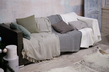 cozy sofa with pillows. Interior in gray tones.