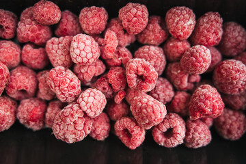 frozen raspberry in a lunch box on white background