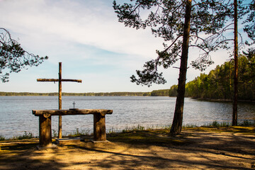 Outdoor wooden altar on the edge of the lake and the forest. Perfect place to celebrate mass or wedding. Finland