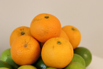 Beautiful lemons and oranges arranged on a table. A fruit rich in vitamin c.