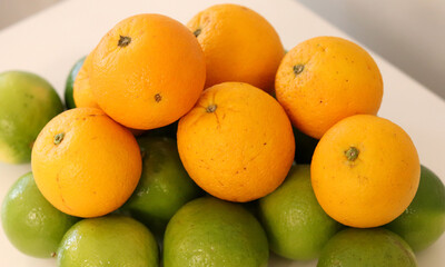 Beautiful lemons and oranges arranged on a table. A fruit rich in vitamin c.