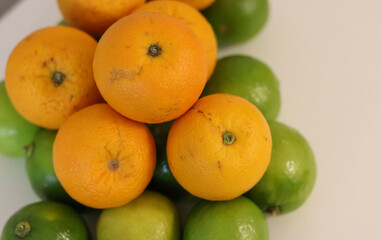 Beautiful lemons and oranges arranged on a table. A fruit rich in vitamin c.