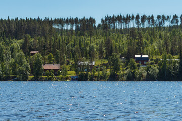 Indalsälven. Buildings and trees on the banks of the Indalsälven River