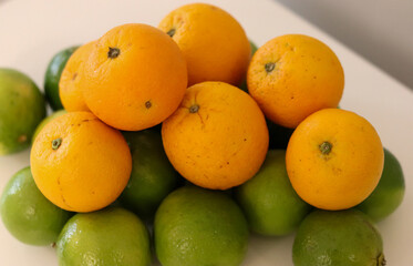 Beautiful lemons and oranges arranged on a table. A fruit rich in vitamin c.