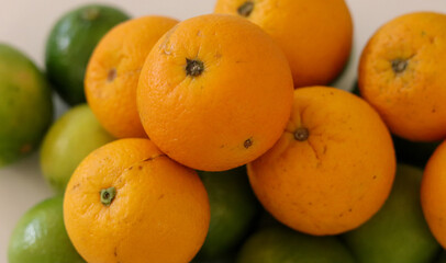 Beautiful lemons and oranges arranged on a table. A fruit rich in vitamin c.