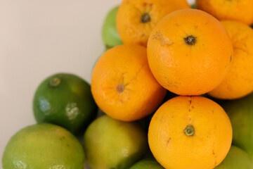 Beautiful lemons and oranges arranged on a table. A fruit rich in vitamin c.