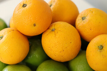 Beautiful lemons and oranges arranged on a table. A fruit rich in vitamin c.