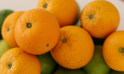 Beautiful lemons and oranges arranged on a table. A fruit rich in vitamin c.