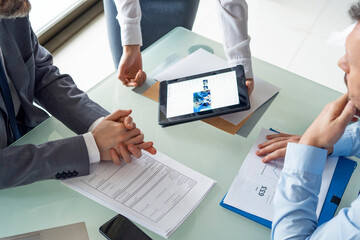 Business people looking at digital tablet