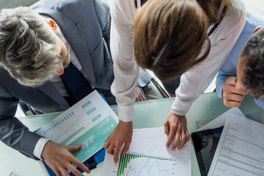 Business people discussing graph