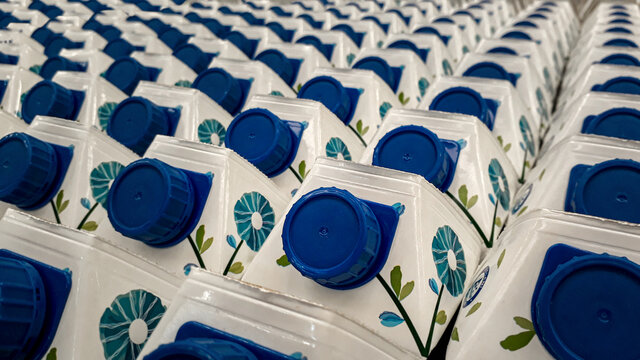 Close up shot of dozens of industrial plastic milk bottles