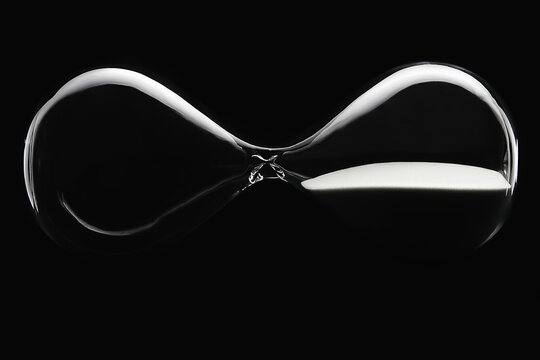 Hour glass on black background