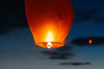 In the evening, at sunset, people with their relatives and friends launch traditional lanterns. Tradition and travel