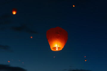 In the evening, at sunset, people with their relatives and friends launch traditional lanterns. Tradition and travel