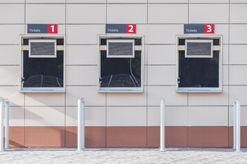 Three windows of the stadium ticket offices.