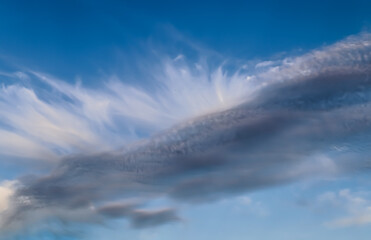 Stunning cirrus cloud formation panorama in a deep blue sky