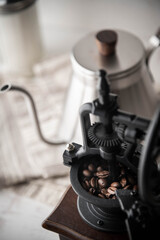 Fototapeta na wymiar coffee bean in antique look mill