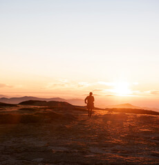 Fototapeta na wymiar Sillhouette of a man against the sunset