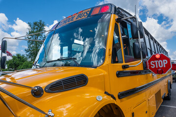 School bus with flashing stop sign extended