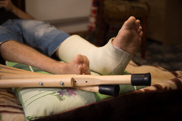 Gypsum is imposed on the man’s leg and walking on crutches is prescribed, and bed rest, as he has...