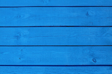 Naklejka premium Wooden boards painted in blue. Close-up. Horizontal view. Background. Texture.