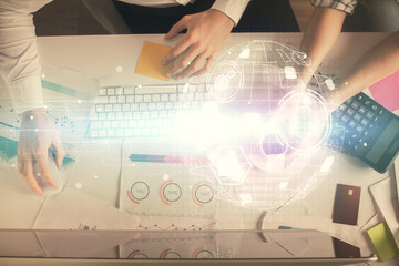 Double exposure of man and woman working together and social network theme hologram drawing. Computer background. connecting concept. Top View.