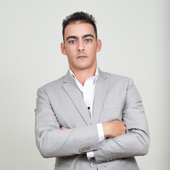 Portrait of young handsome businessman wearing suit