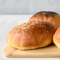 hot homemade buns with sesame and poppy seeds