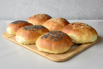 hot homemade buns with sesame and poppy seeds