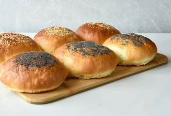 hot homemade buns with sesame and poppy seeds