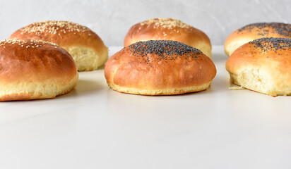 hot homemade buns with sesame and poppy seeds