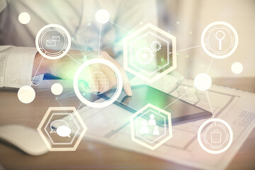 Double exposure of man's hands holding and using a phone and social network theme drawing.