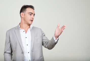 Portrait of young handsome businessman wearing suit