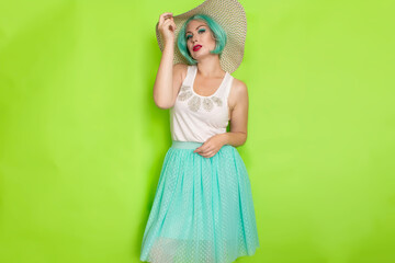 Beautiful young mint haired woman in white top and blue middle skirt wearing white and black hat.
