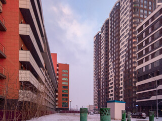 New modern buildings of the housing complex Symbol on the site of the hammer and Sickle factory against the sunset sky